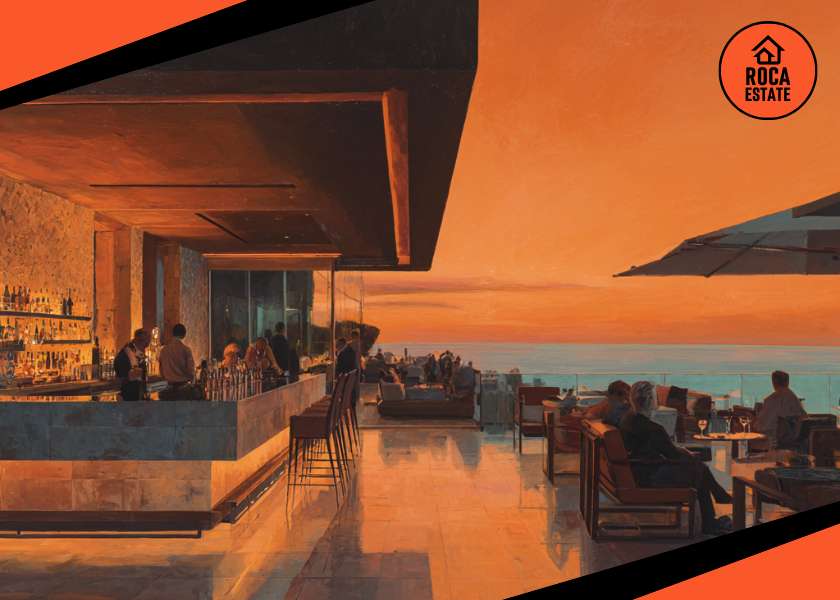 Rooftop bar at a luxury hotel in the Algarve at sunset, symbolizing high-end tourism and investment opportunities in Portugal’s commercial real estate market.